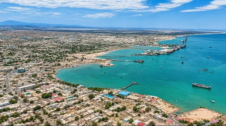 An aerial view of a coastal city meeting the Indian Ocean
